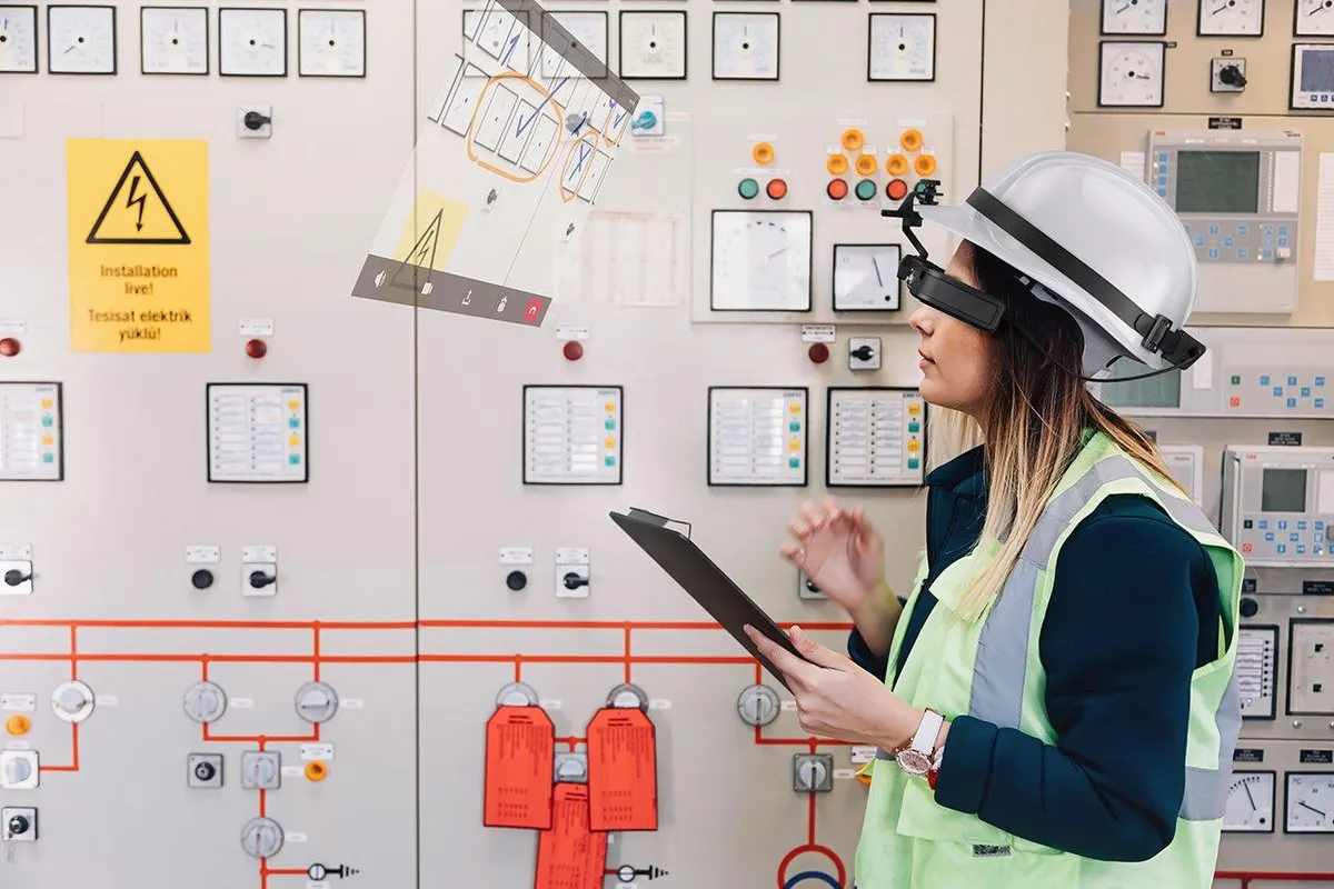 Epson Moverio BT-45CS, worker wearing a hard hat using Epson Moverio BT-45CS while working on an electrical panel