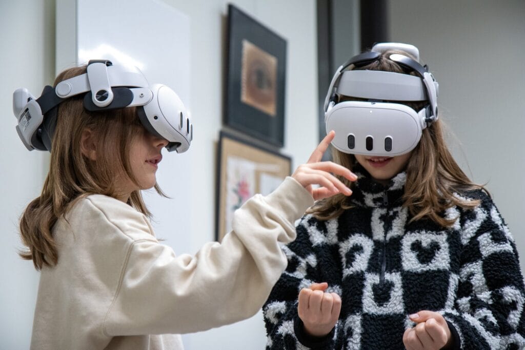 Two pupils wearing VR headsets during a virtual reality task at Harmonia Jeżyce Private Primary School