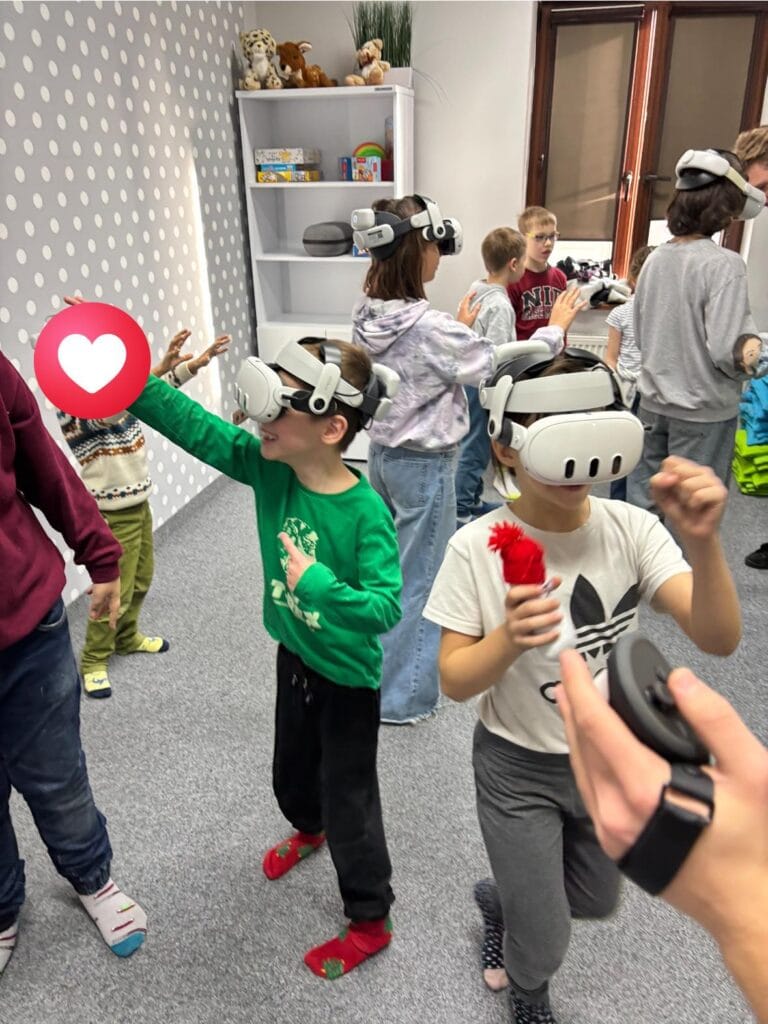 A group of children wearing VR headsets and holding controllers during a virtual reality class at Harmonia Nieszawska Primary School