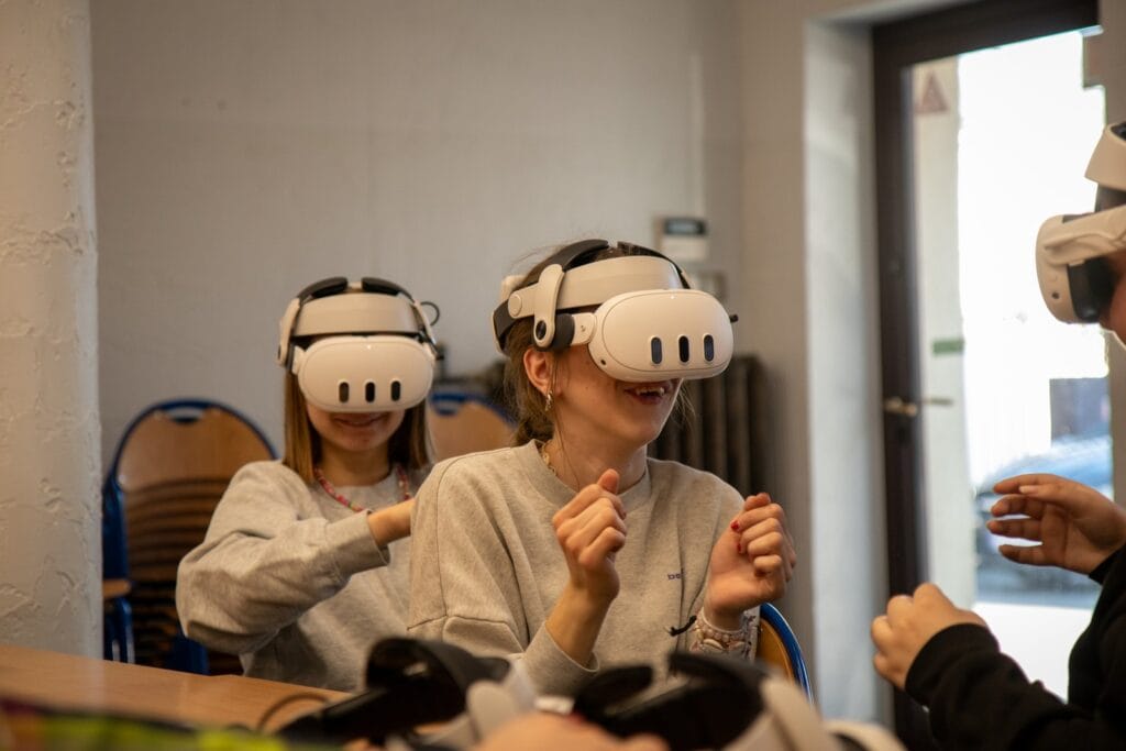 Pupils wearing VR headsets on a virtual geography trip at Harmonia Primary School in Suchy Las