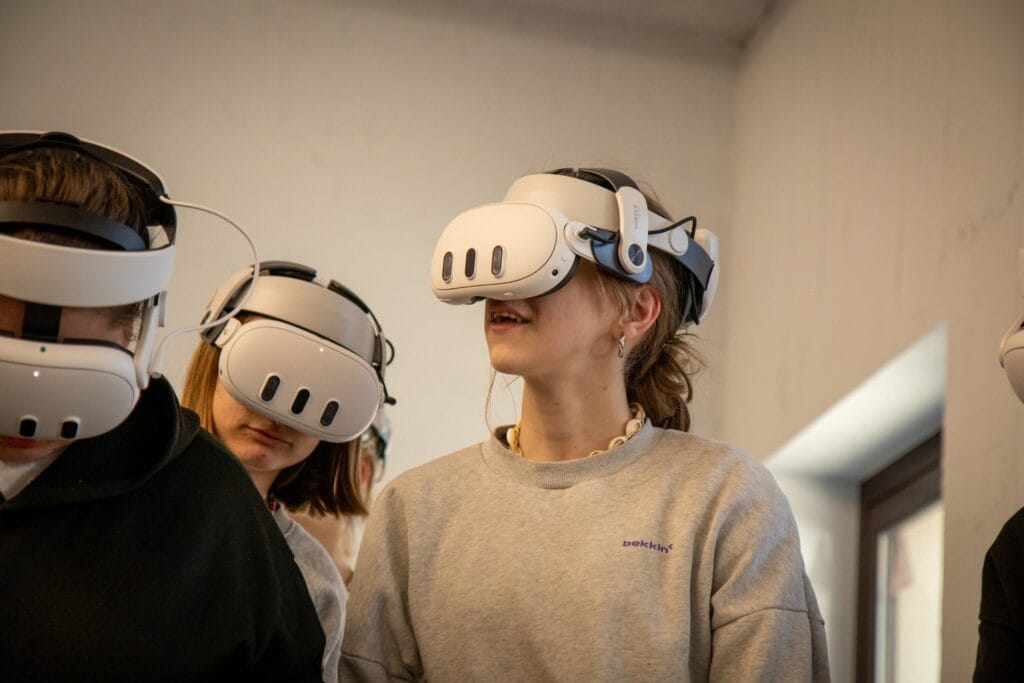 Two pupils wearing VR headsets during a geography class at Harmonia Primary School in Suchy Las