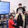 Children wearing VR headsets in front of a Zenith XR workshop screen at Olimpus Primary School in Gutowo Małe
