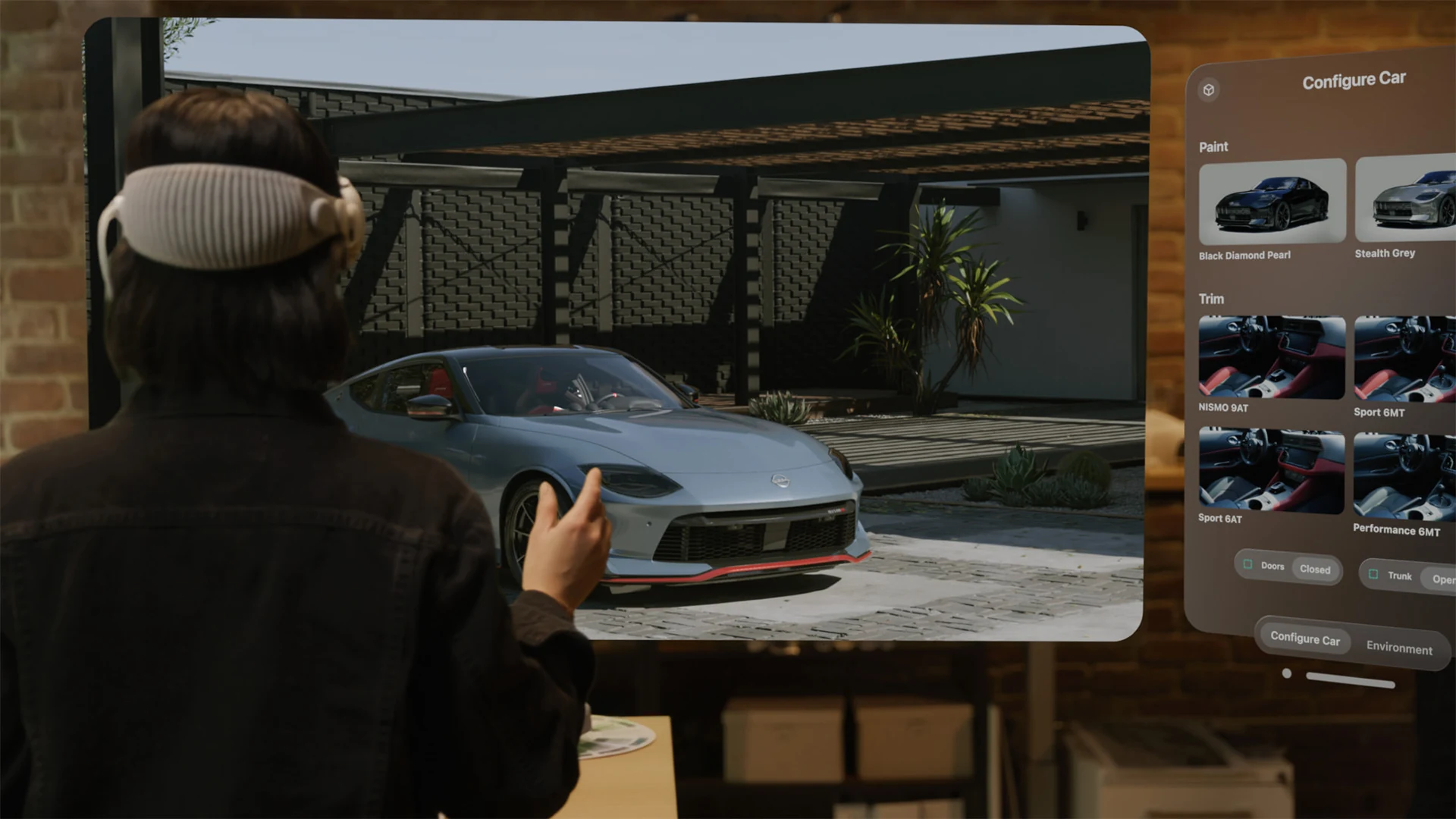 Apple Vision Pro user viewing a car model in an NVIDIA Omniverse demonstration