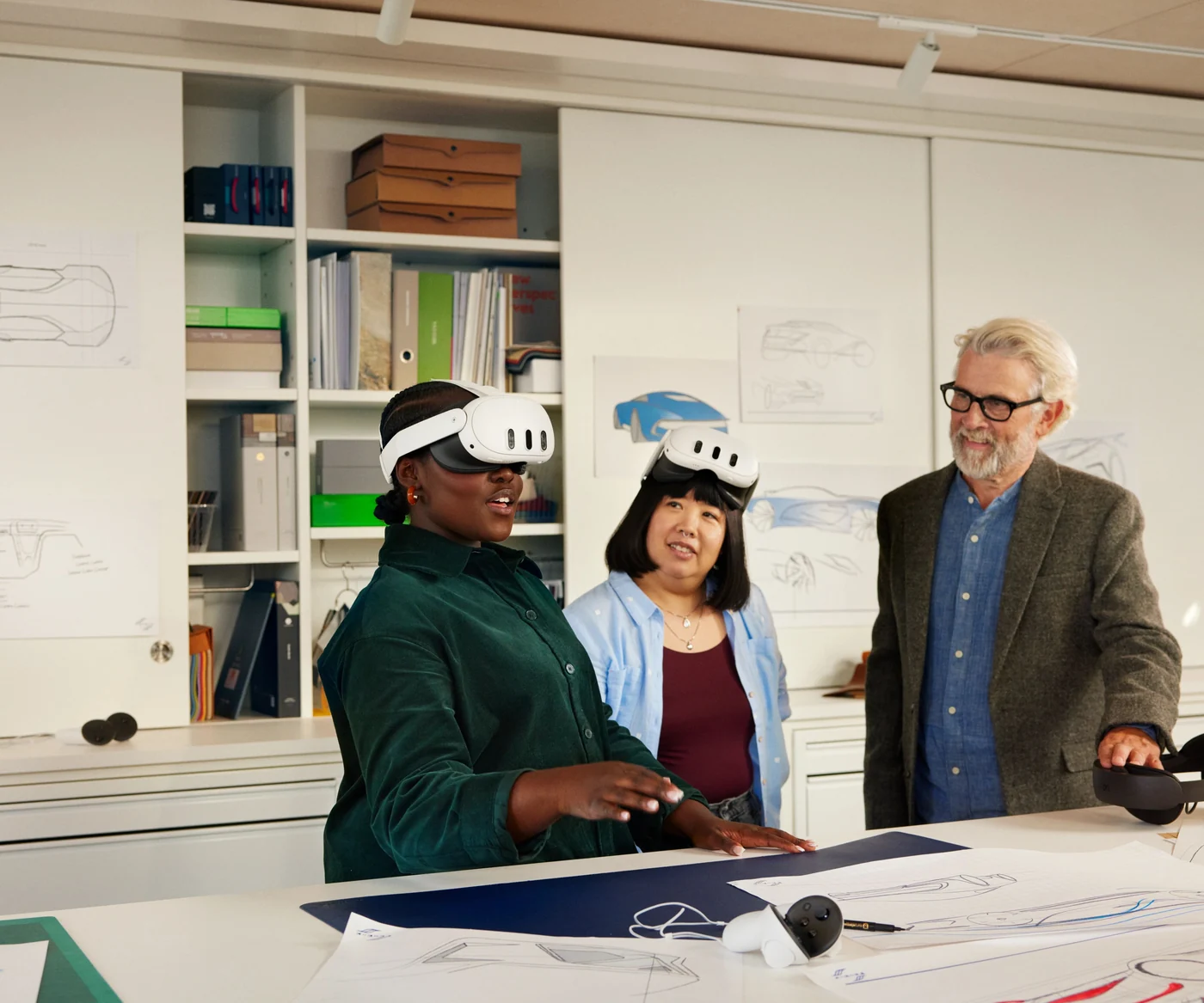 Students wearing headsets and a teacher at a table