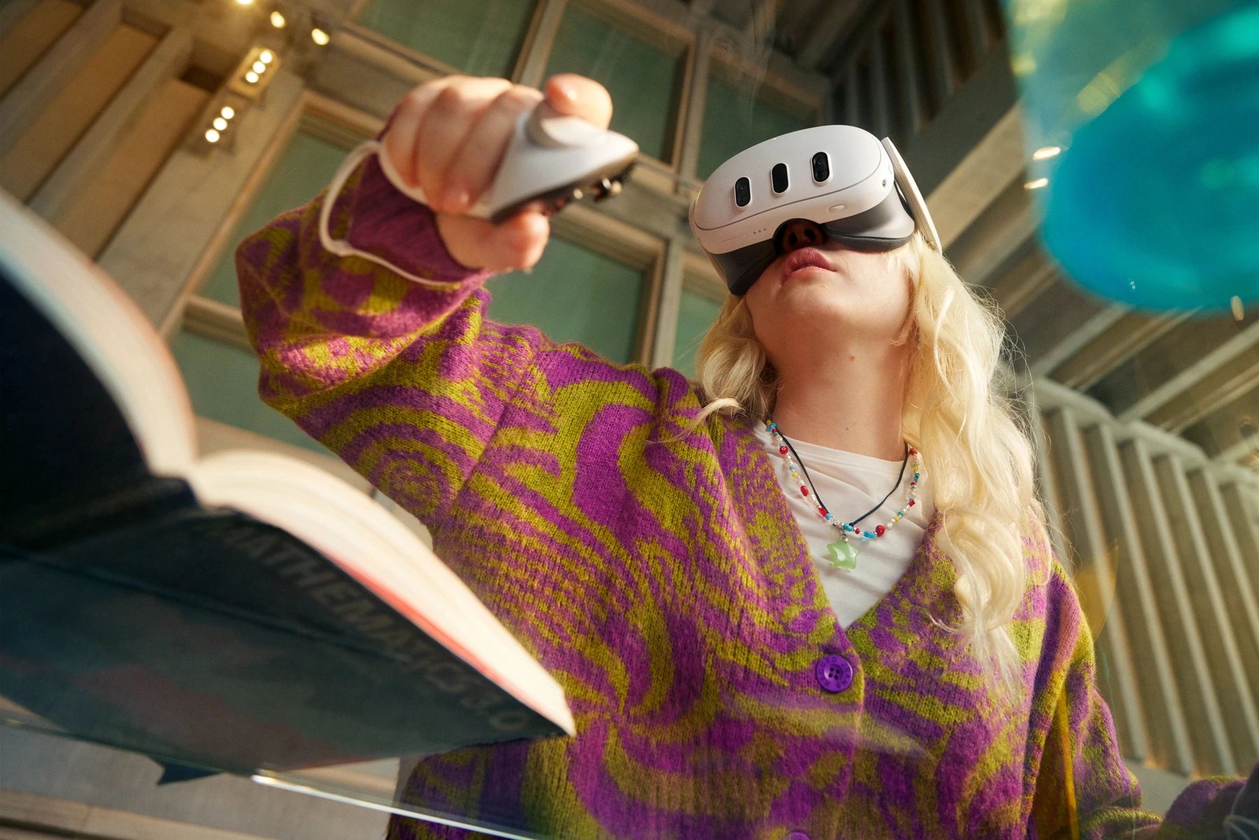 A participant using a controller during a Meta Quest headset exercise