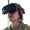 Woman using a Meta Quest Pro headset in virtual reality