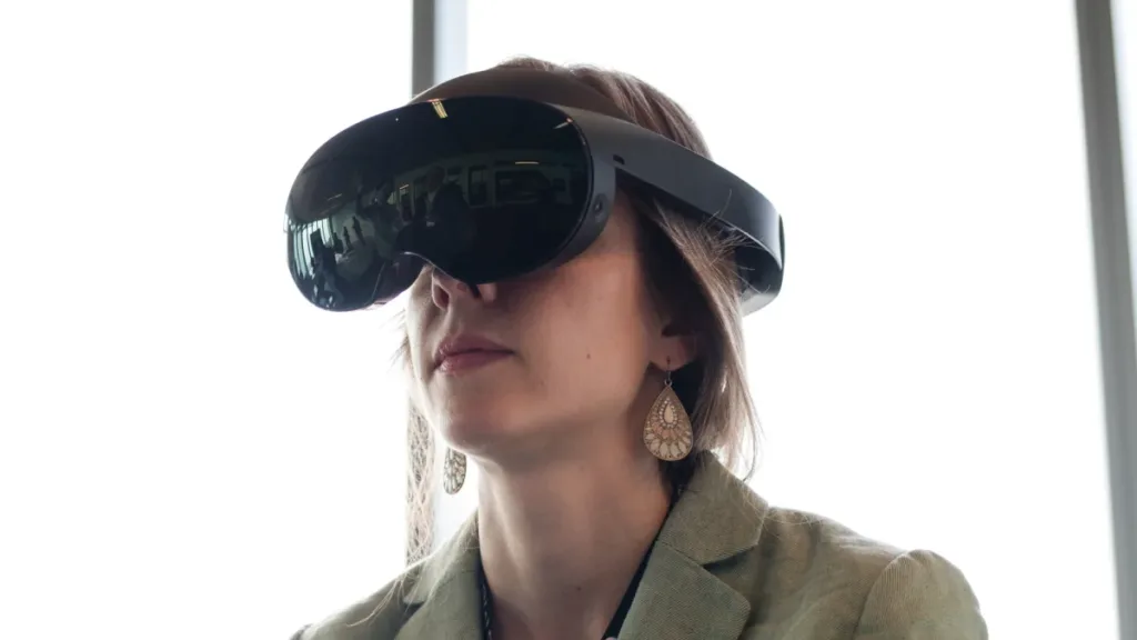 Woman using a Meta Quest Pro headset in virtual reality