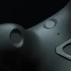 Close-up of an HTC VIVE Tracker 3.0 on a black background