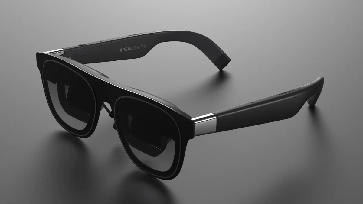 Black XREAL One Pro glasses on a grey tabletop